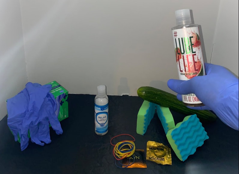 Various materials and tools such as latex gloves, lube and rubber bands for creating a diy fleshlight with personalized features.