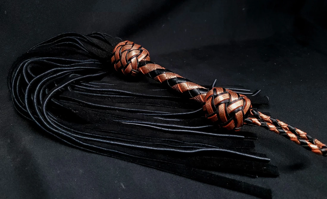 A femdom play sex toy called a long tailed flogger.